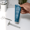 oars and alps shaving cream with razor on counter